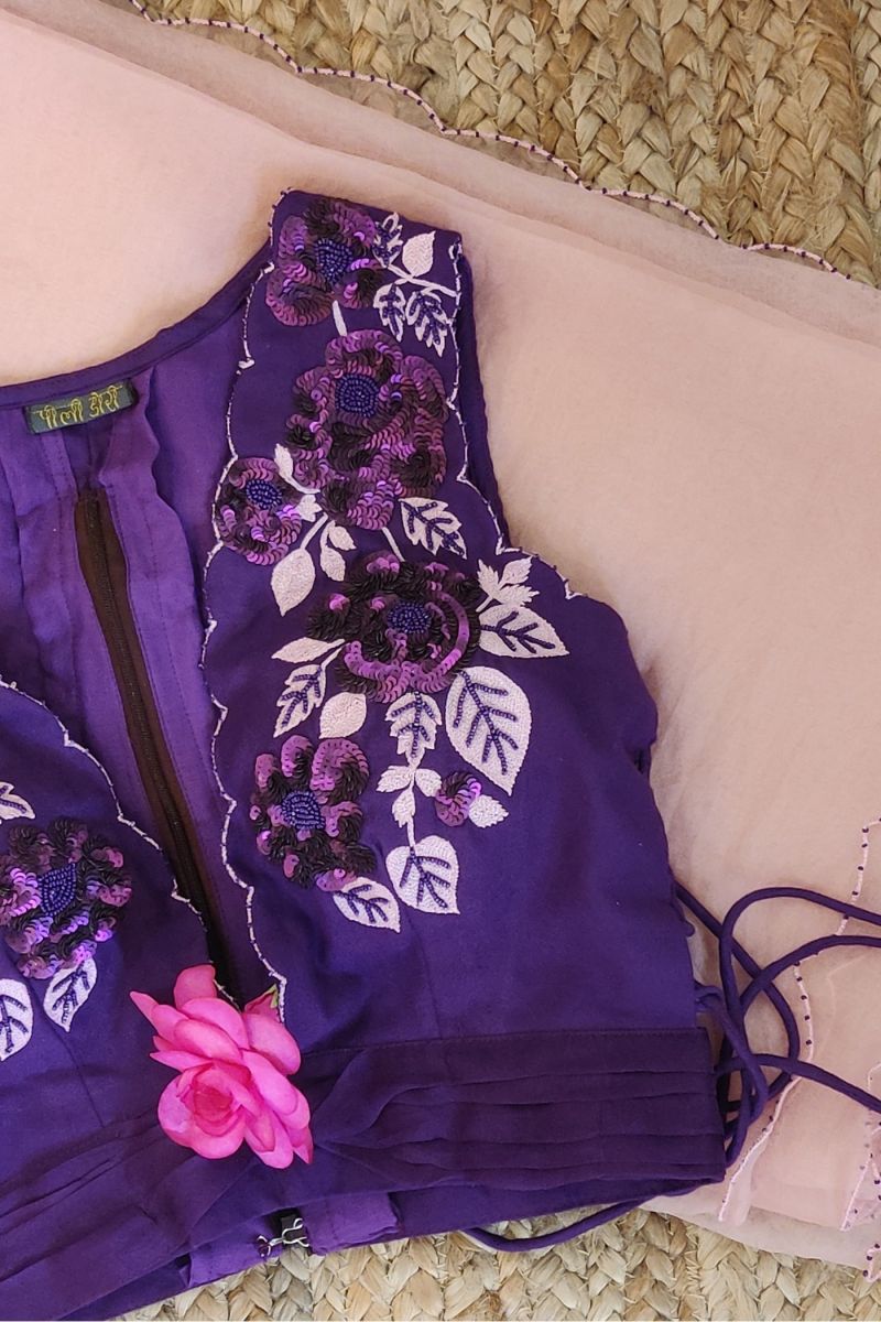 An elegant purple silk blouse embellished colour fully makes a perfect pair  with the kancheevaram Silk